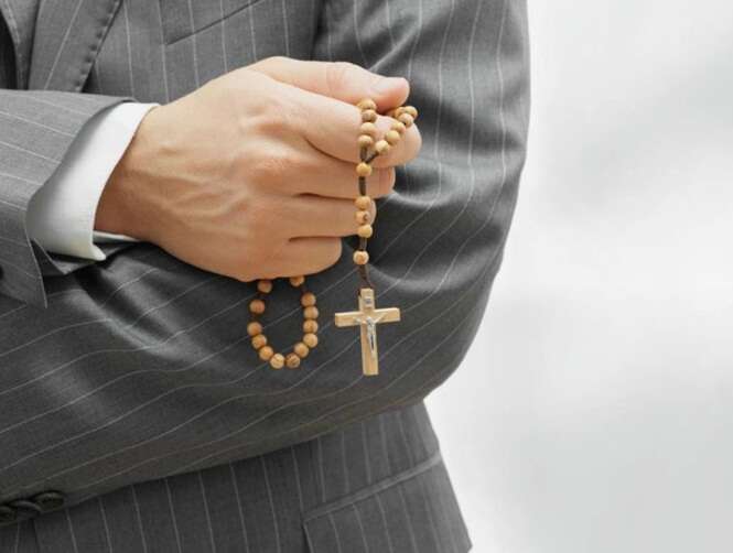 Man holding rosary beads