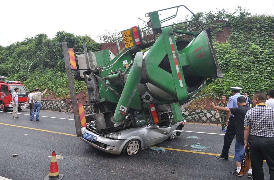 Woman Survives After Her Car is Flattened by a Cement Mixer, Hangzhou, Zhejiang Province, China - 18 Aug 2014