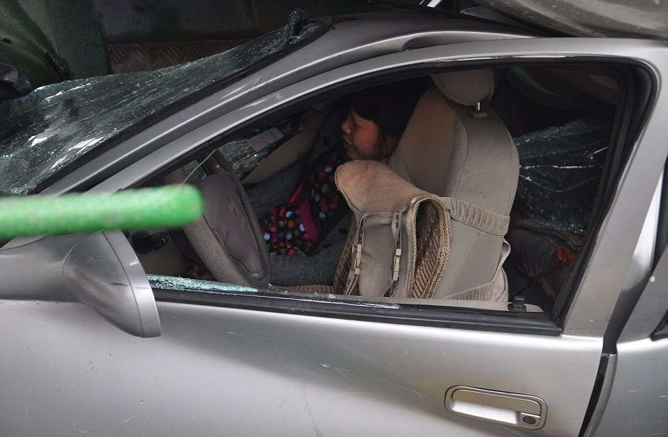 Woman Survives After Her Car is Flattened by a Cement Mixer, Hangzhou, Zhejiang Province, China - 18 Aug 2014