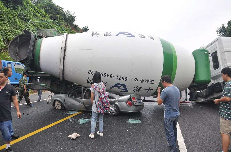 Woman Survives After Her Car is Flattened by a Cement Mixer, Hangzhou, Zhejiang Province, China - 18 Aug 2014