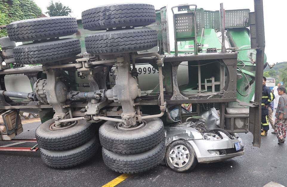 Woman Survives After Her Car is Flattened by a Cement Mixer, Hangzhou, Zhejiang Province, China - 18 Aug 2014