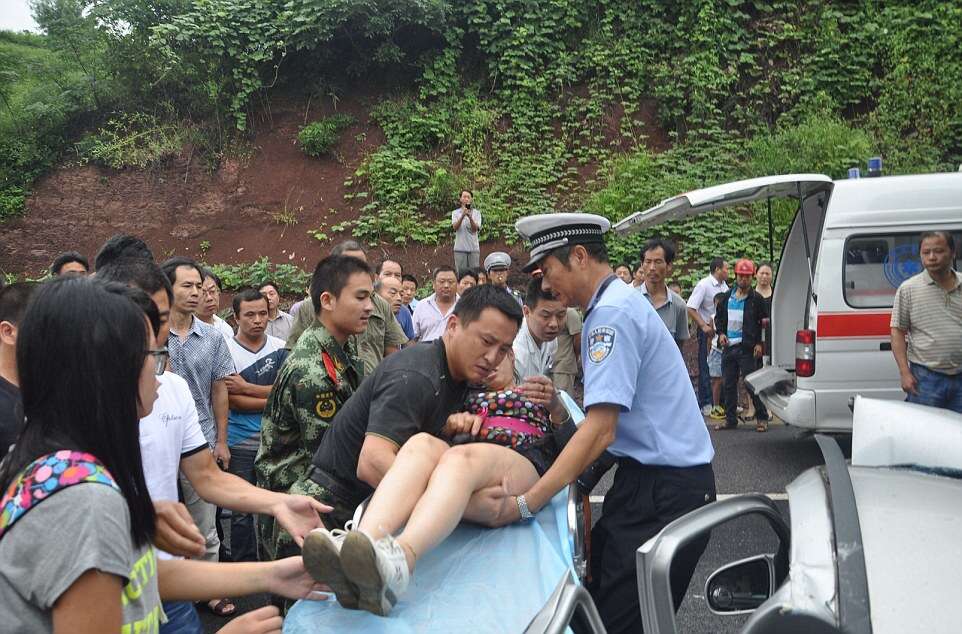 Woman Survives After Her Car is Flattened by a Cement Mixer, Hangzhou, Zhejiang Province, China - 18 Aug 2014