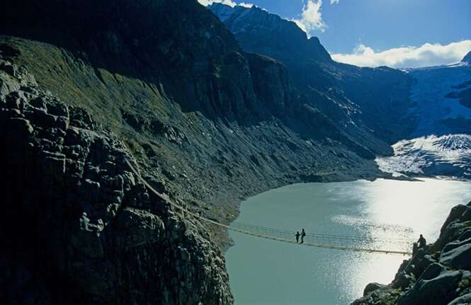 Lake Trift Switzerland Canton of Bern Bernese Oberland lake glacier mountains suspension bridge traveller Landscape scenery