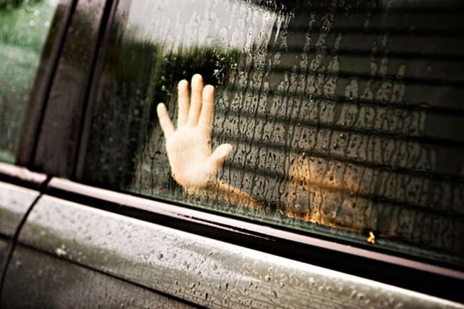 Hand at car window